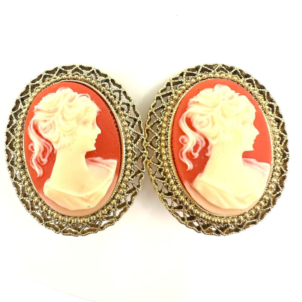 1928 signed gold tone pink resin cameo woman's face oval clip on earrings